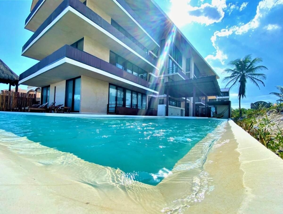 In Tankah Bay Where Jungle Meets Apartment